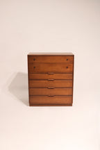 Full view of mid century modern highboy dresser made from solid walnut wood with sleek vertical design