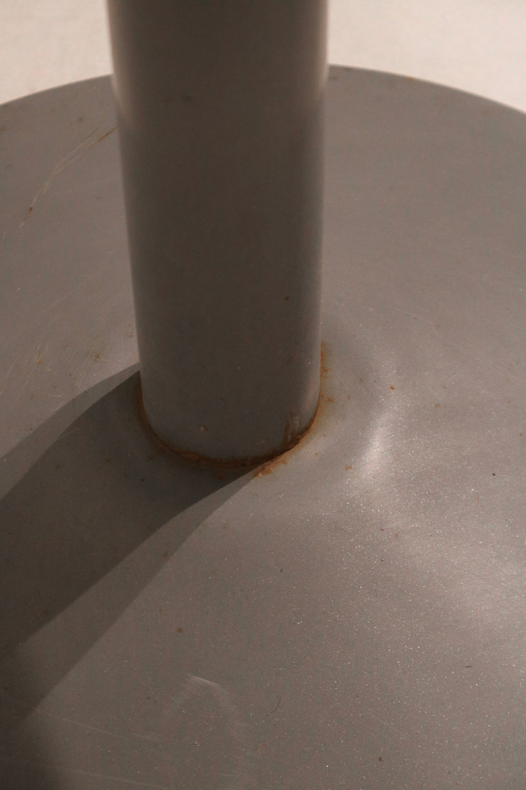 Detail of base with minor wear, showcasing the aged industrial steel character