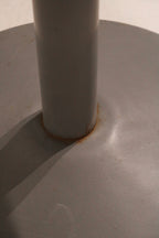 Detail of base with minor wear, showcasing the aged industrial steel character