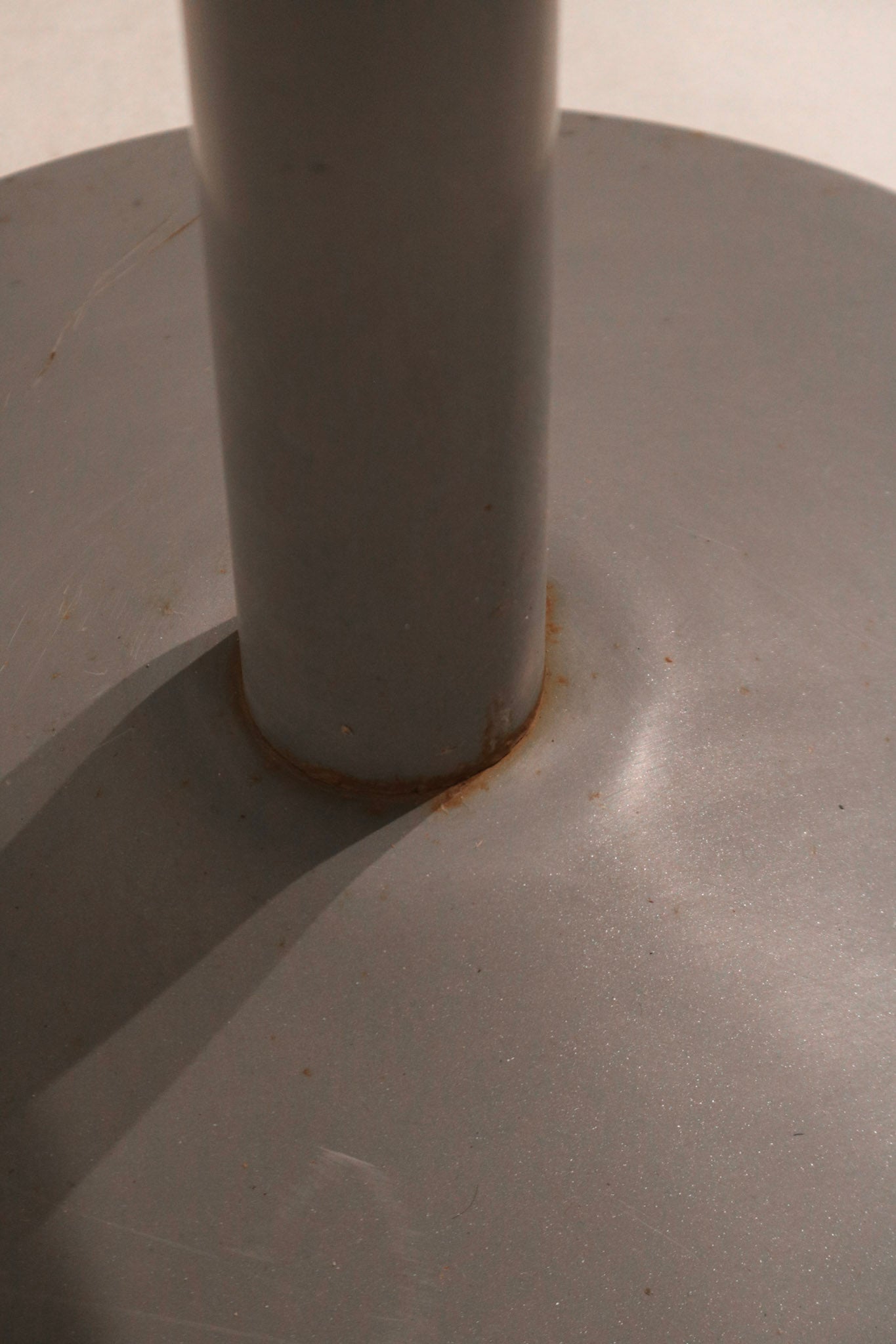 Detail of base with minor wear, showcasing the aged industrial steel character