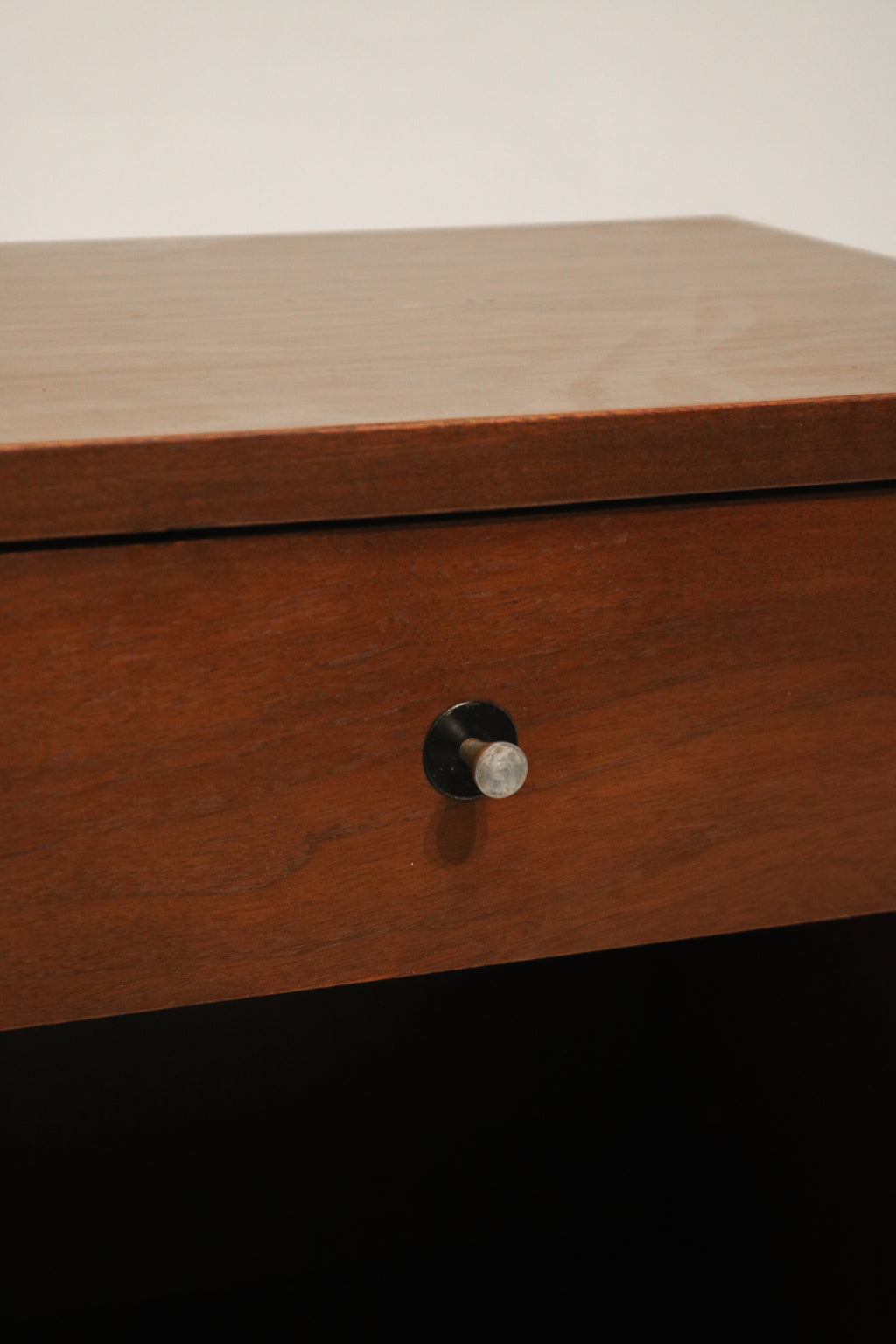 Close-up of solid walnut wood grain texture on Vintage Mcm Nightstand's surface
