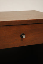 Close-up of solid walnut wood grain texture on Vintage Mcm Nightstand's surface