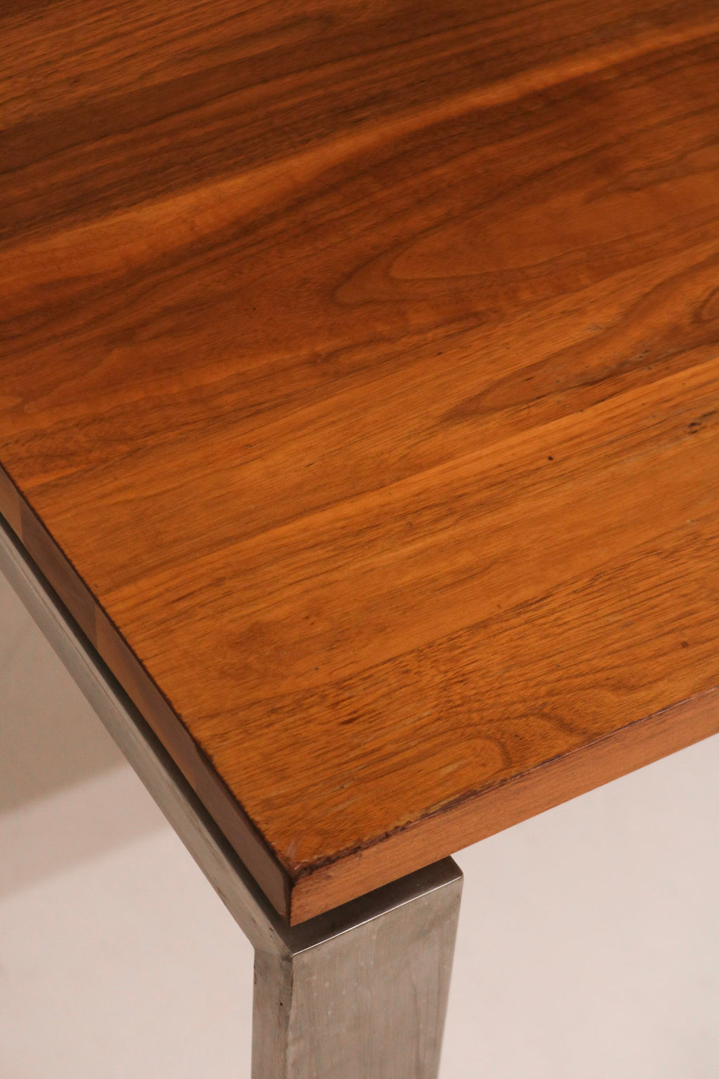 Detail of leg structure showing solid steel material and slightly distressed finish