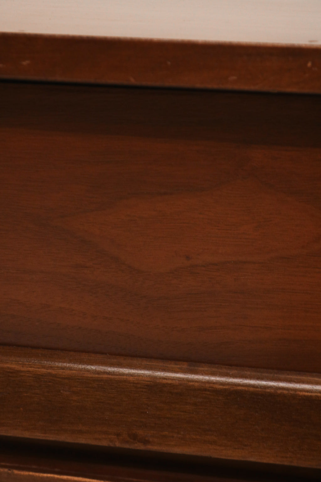 Detail of nightstand drawer showing dovetail joints and smooth wood finish