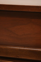 Detail of nightstand drawer showing dovetail joints and smooth wood finish