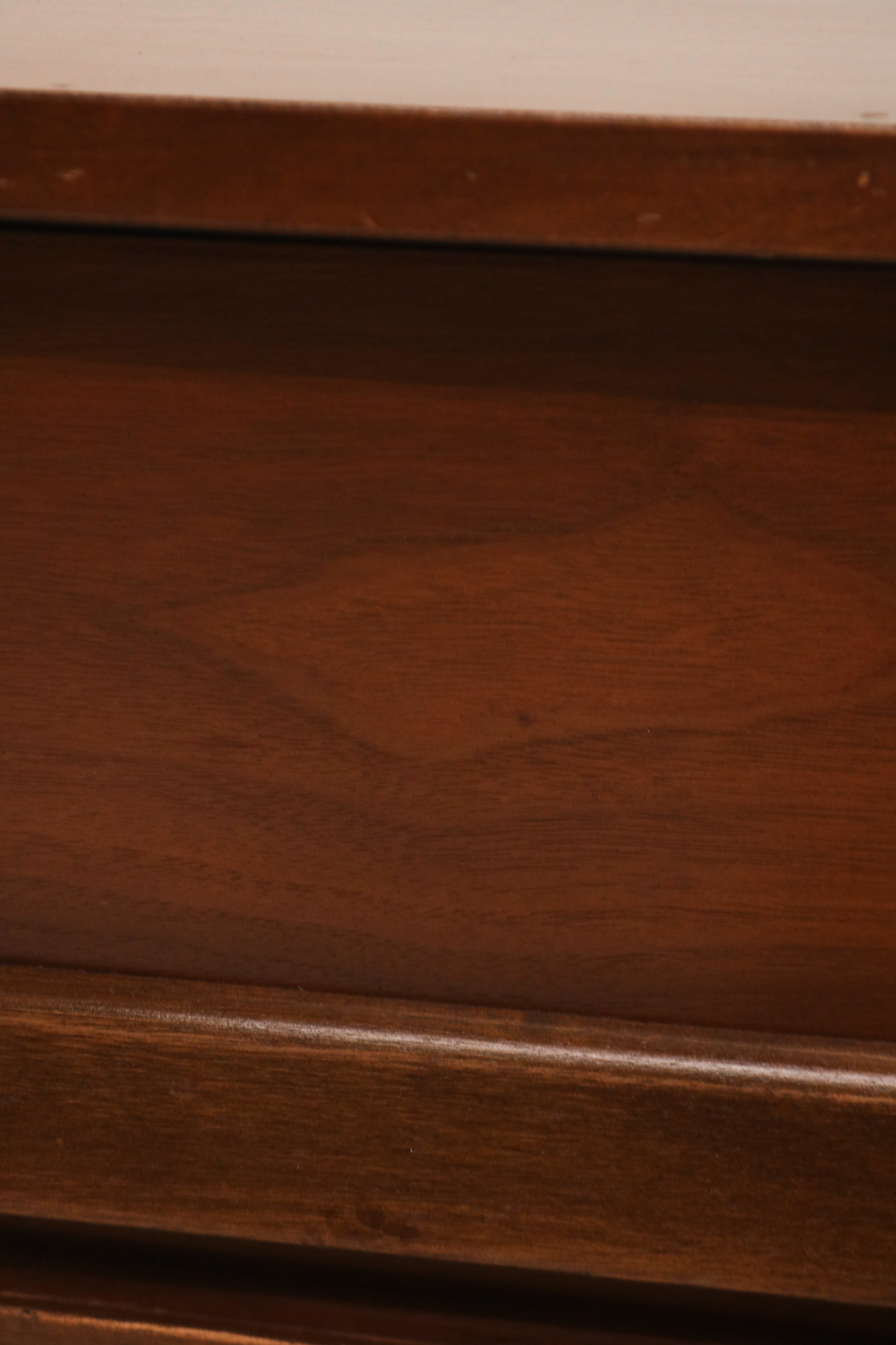 Detail of nightstand drawer showing dovetail joints and smooth wood finish