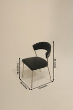 Stylish black dining chairs with brushed metal legs