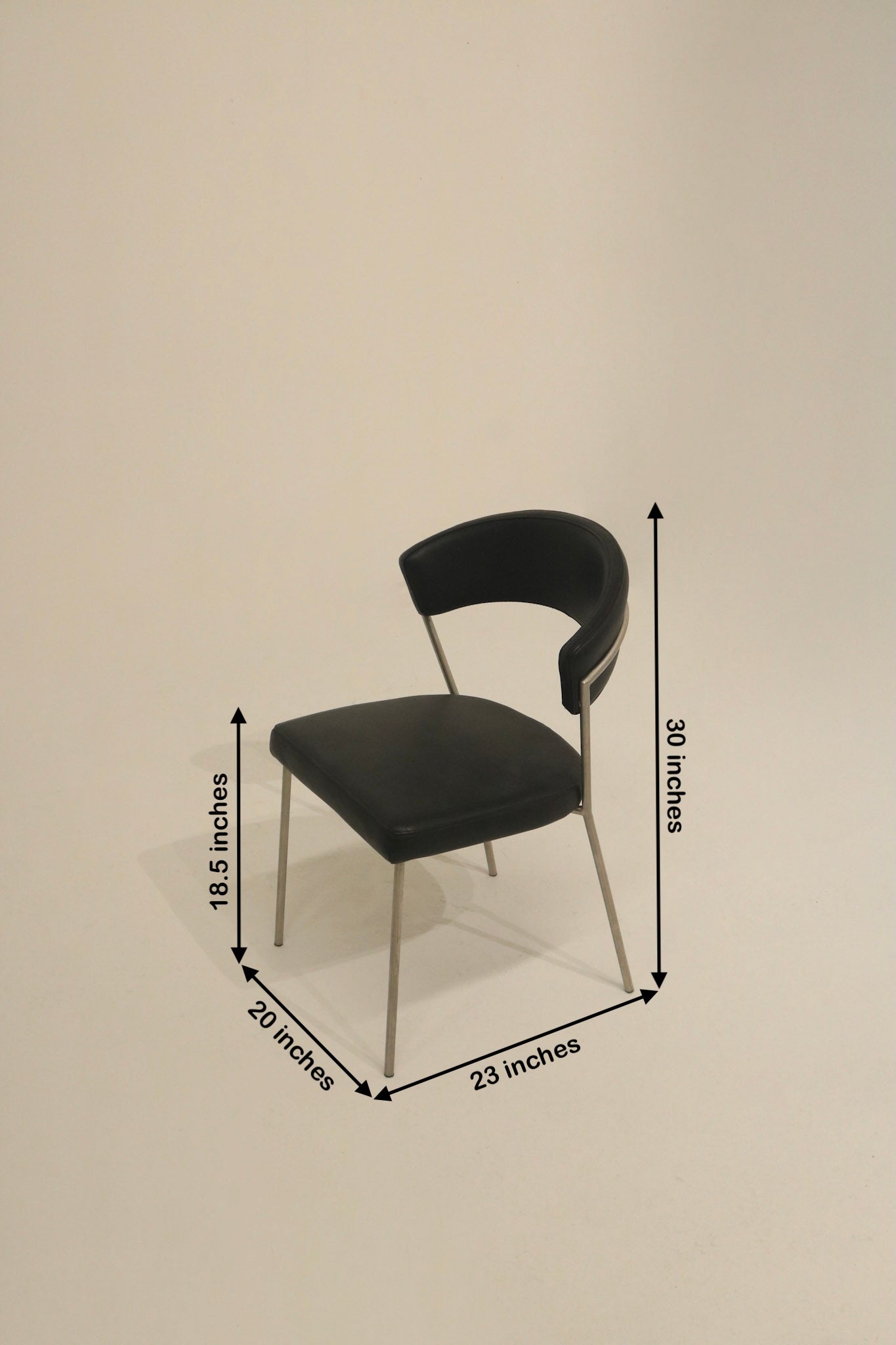Stylish black dining chairs with brushed metal legs