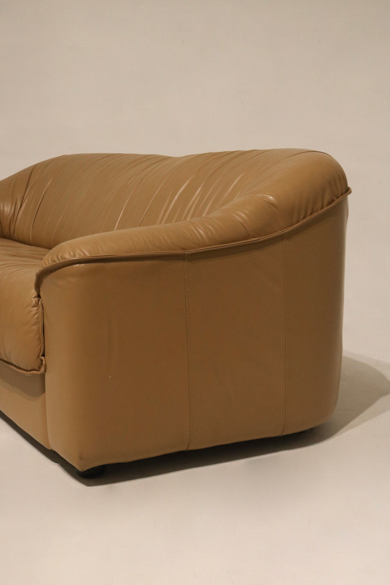 Interior shot showing seat depth and backrest insulation of vintage leather couch