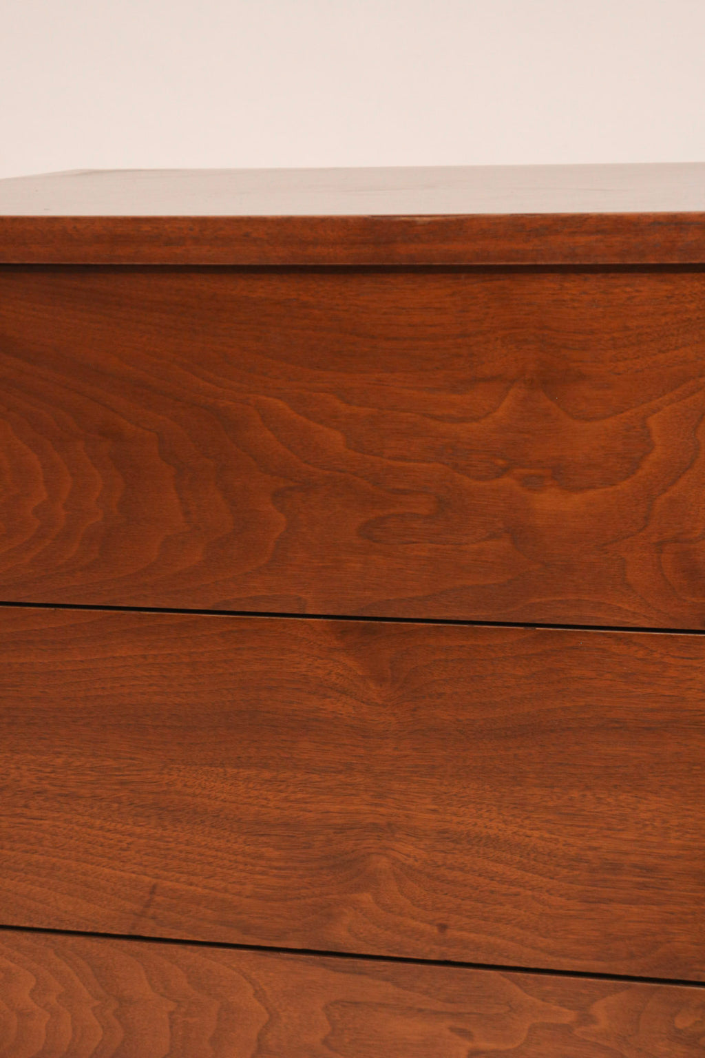 Close-up of drawer fronts showing walnut texture and finish quality