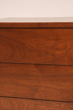 Close-up of drawer fronts showing walnut texture and finish quality
