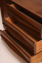 Close-up of drawer handle showing metal hardware and vintage finish