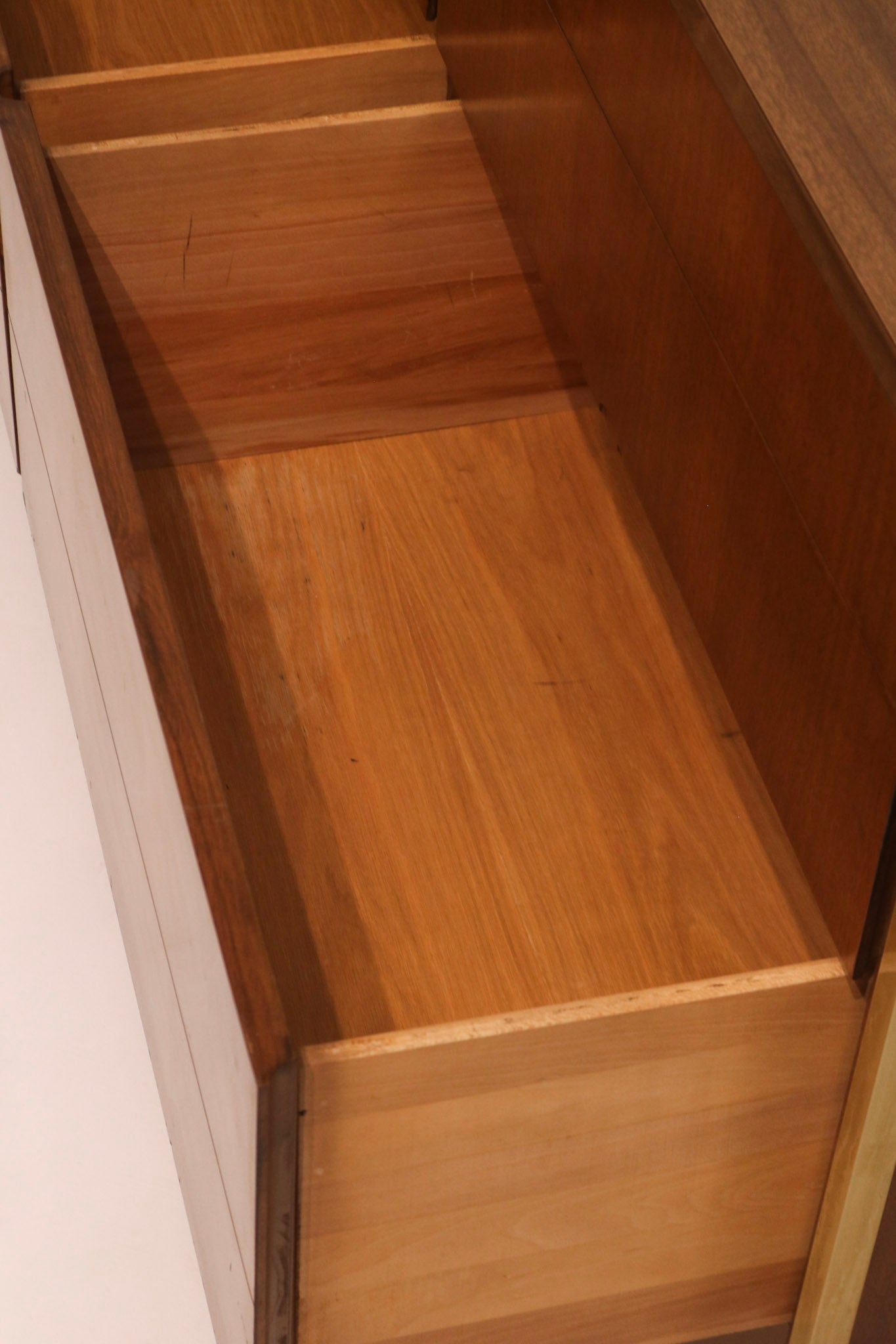 Interior view of drawer showing clean wood condition and joinery