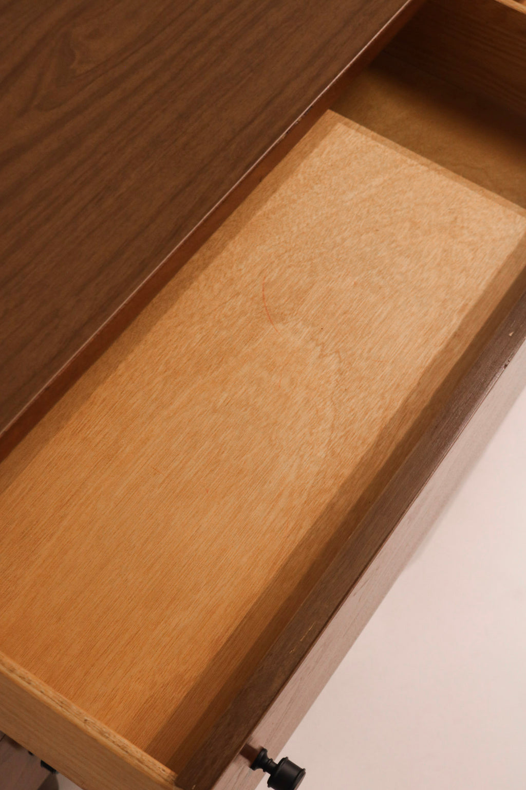 Interior view of drawer showing clean wood condition and finish