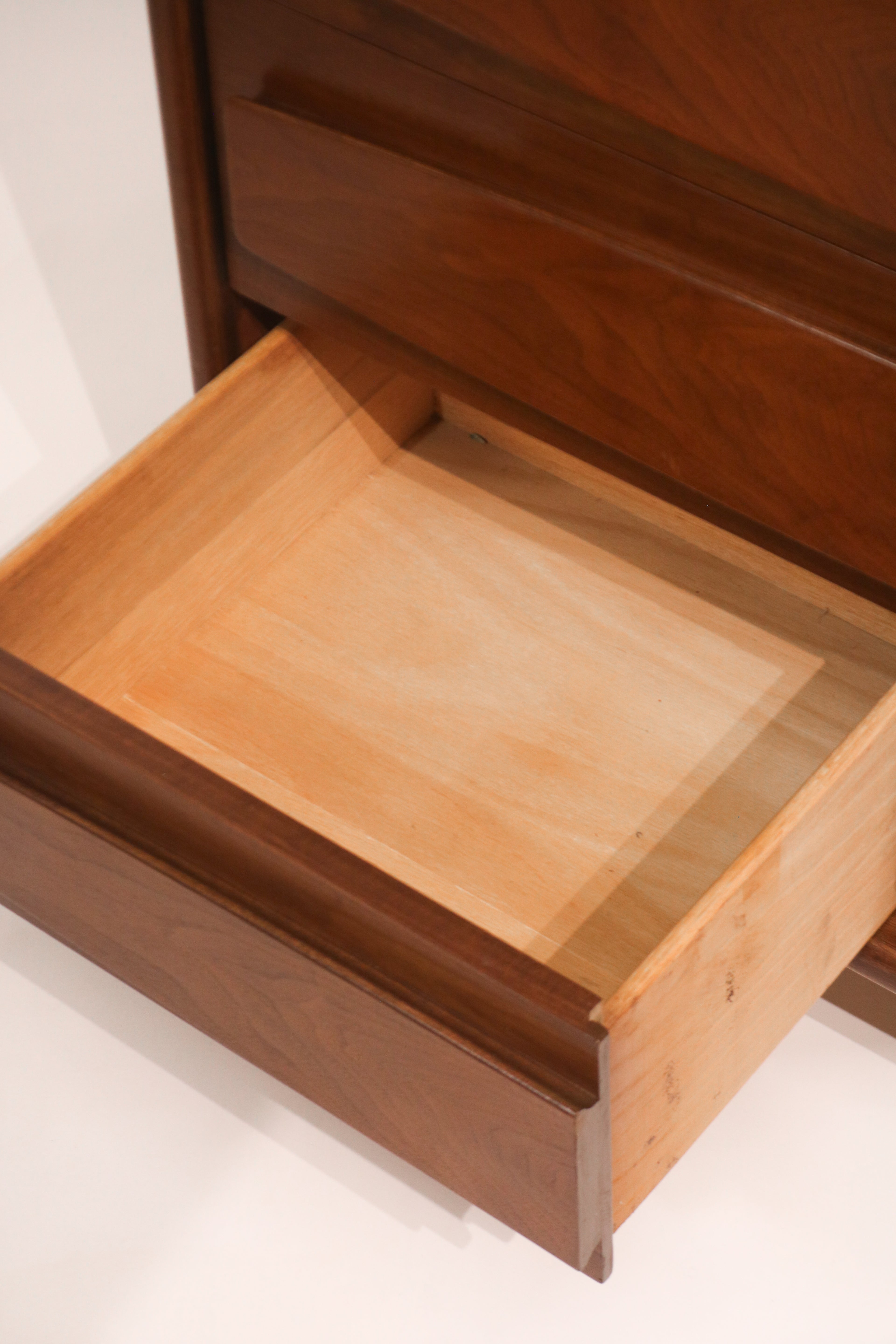 Interior view of drawer showing clean wood finish and solid bottom