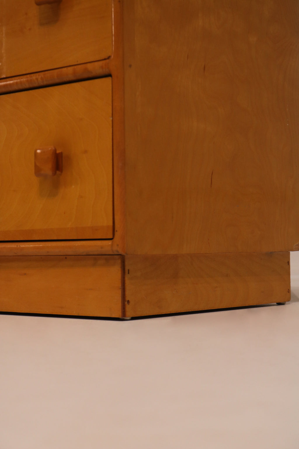 Interior view of drawer showing particle board bottom construction