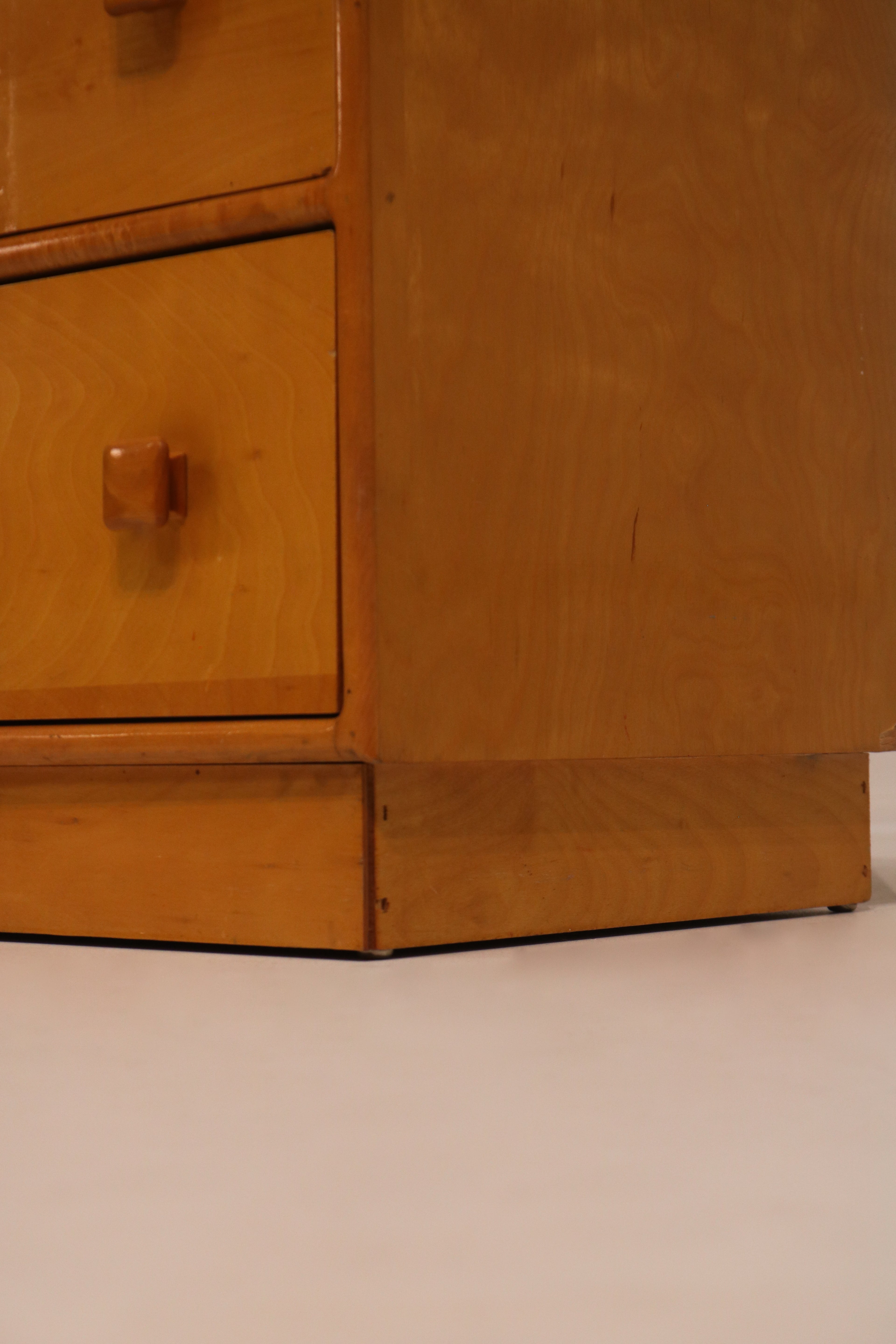 Interior view of drawer showing particle board bottom construction