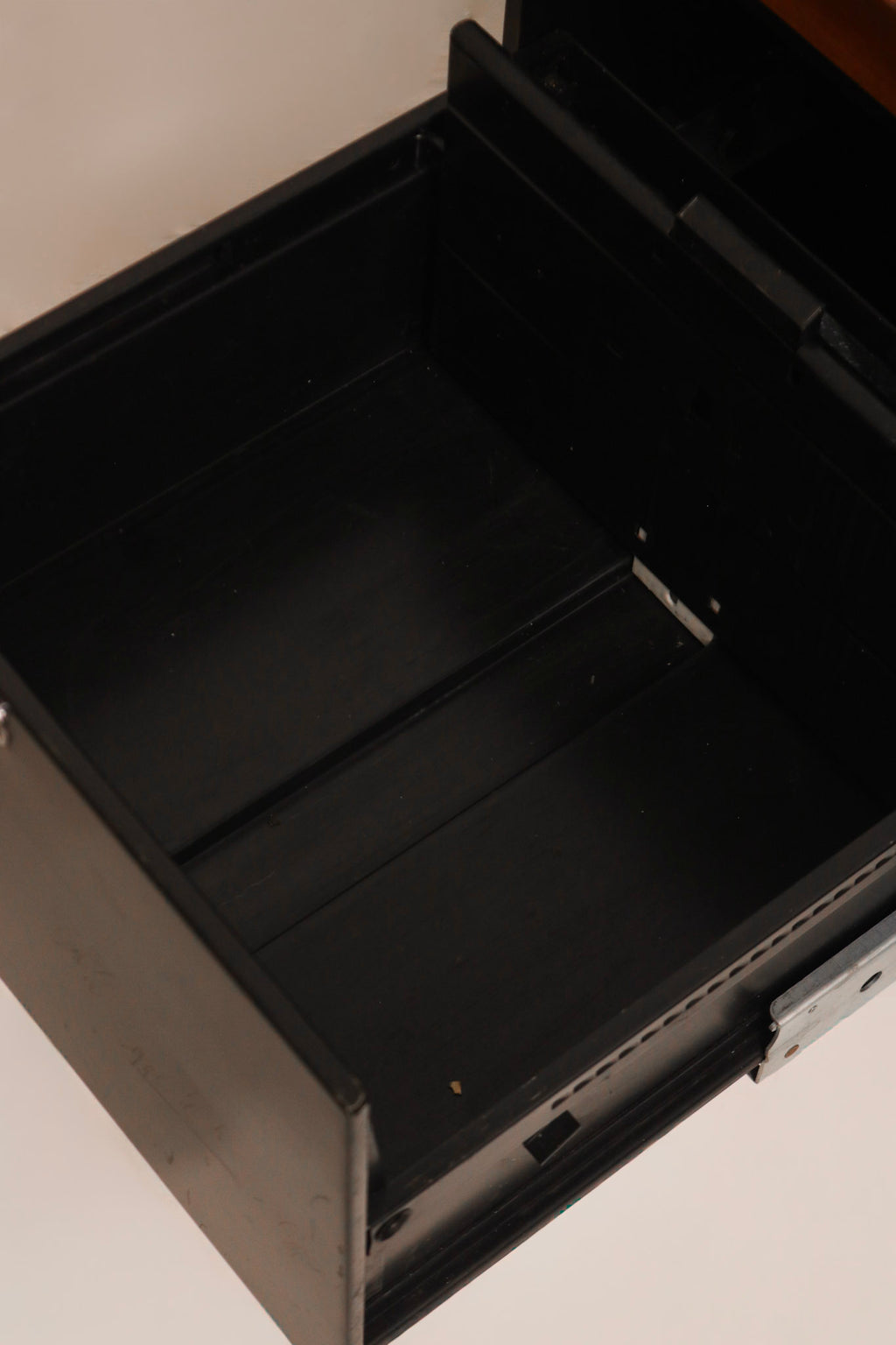 Interior view of steel drawer construction with black finish