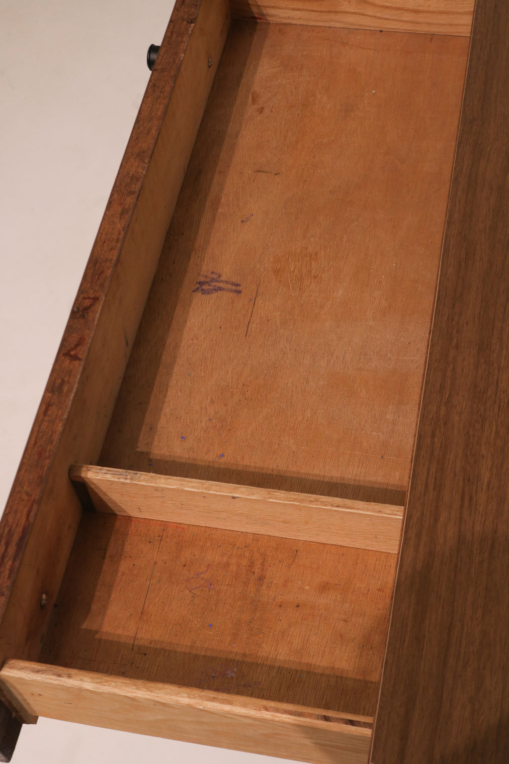 Interior view of drawer showing wood condition and noted stains