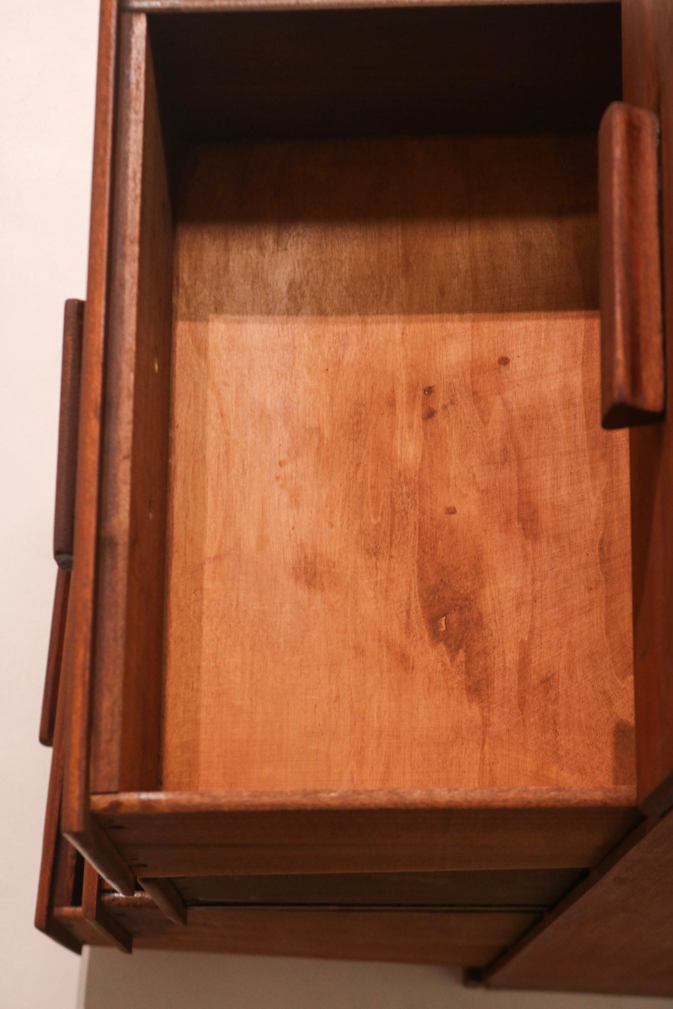 Interior view of drawer showing clean stained wood and solid construction