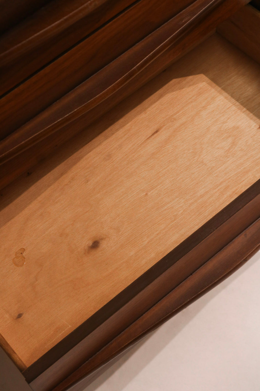 Detail of drawer interior showing wood surfaces and clean condition