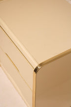 Side profile of drawer showing white lacquered front and wood side structure