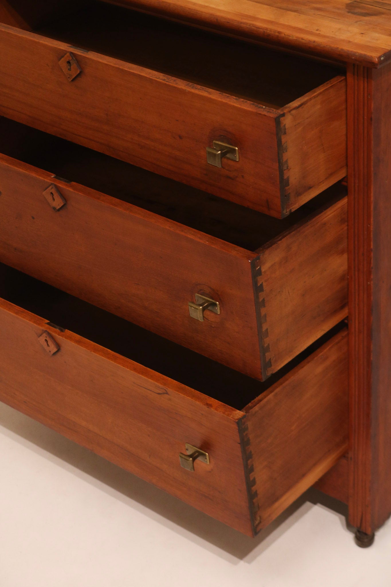 Side view of open drawers showing antique construction and depth