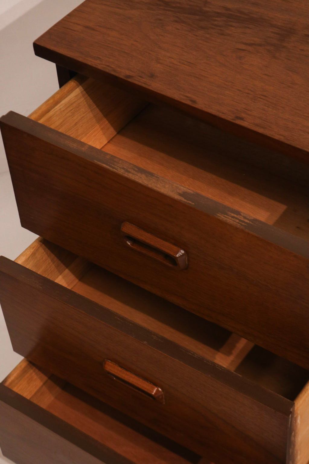 Rear low-angle view demonstrating cabinet body and leg attachment structure