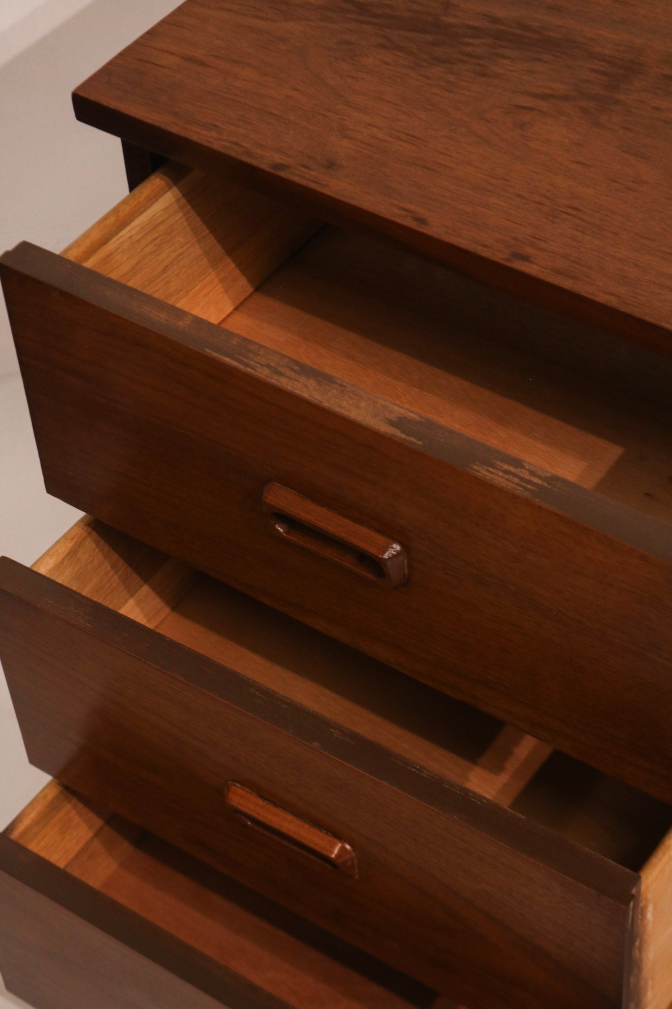 Rear low-angle view demonstrating cabinet body and leg attachment structure