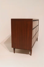 Side view of walnut dresser showing veneer finish and clean lines
