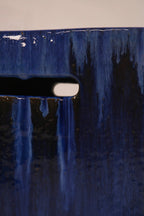 Detail of the drip glaze pattern showing contrast between blue and dark tones