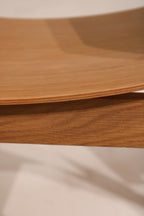 Close-up of plywood edge showing layer construction and bending technique