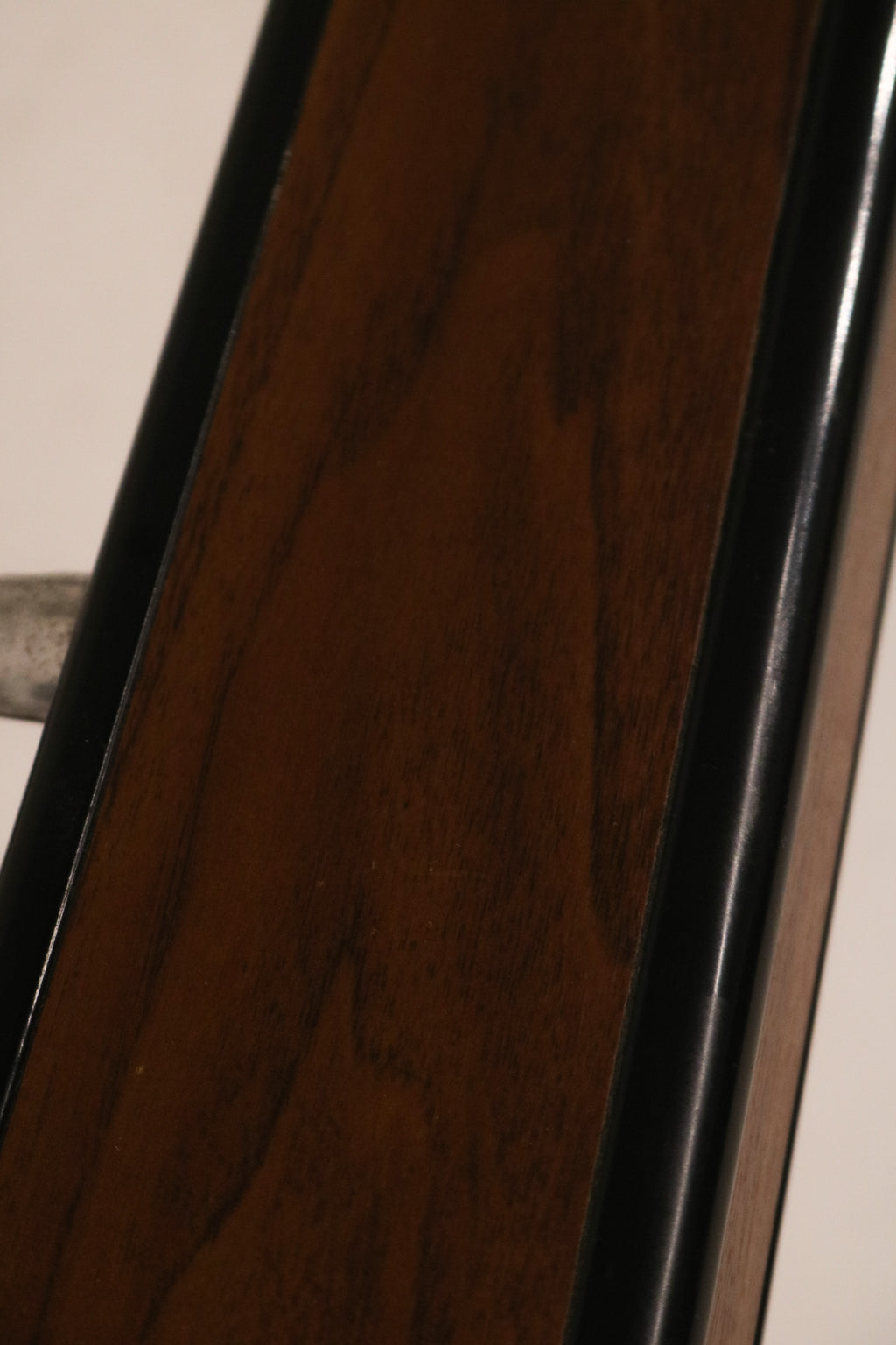 Macro view of the faux wood grain laminate texture on metal