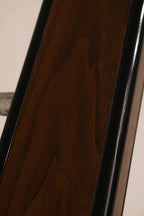 Macro view of the faux wood grain laminate texture on metal