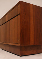 Flip-top storage compartment open view showing hidden functionality