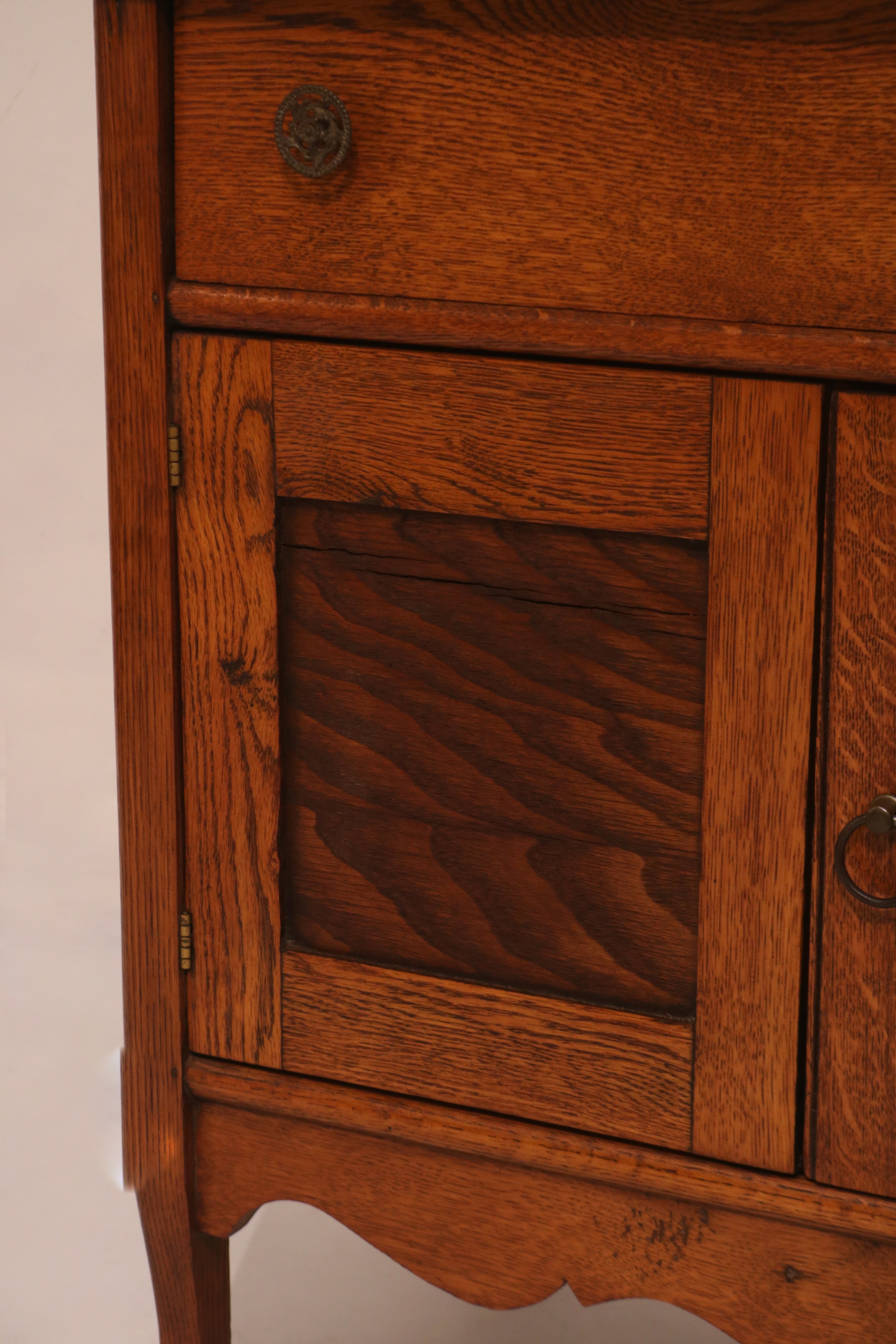 Full front view of the antique washstand design with drawer and cabinet