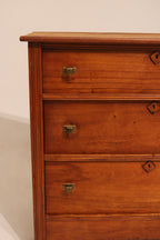 Straight front view showing the alignment of the three drawer stack
