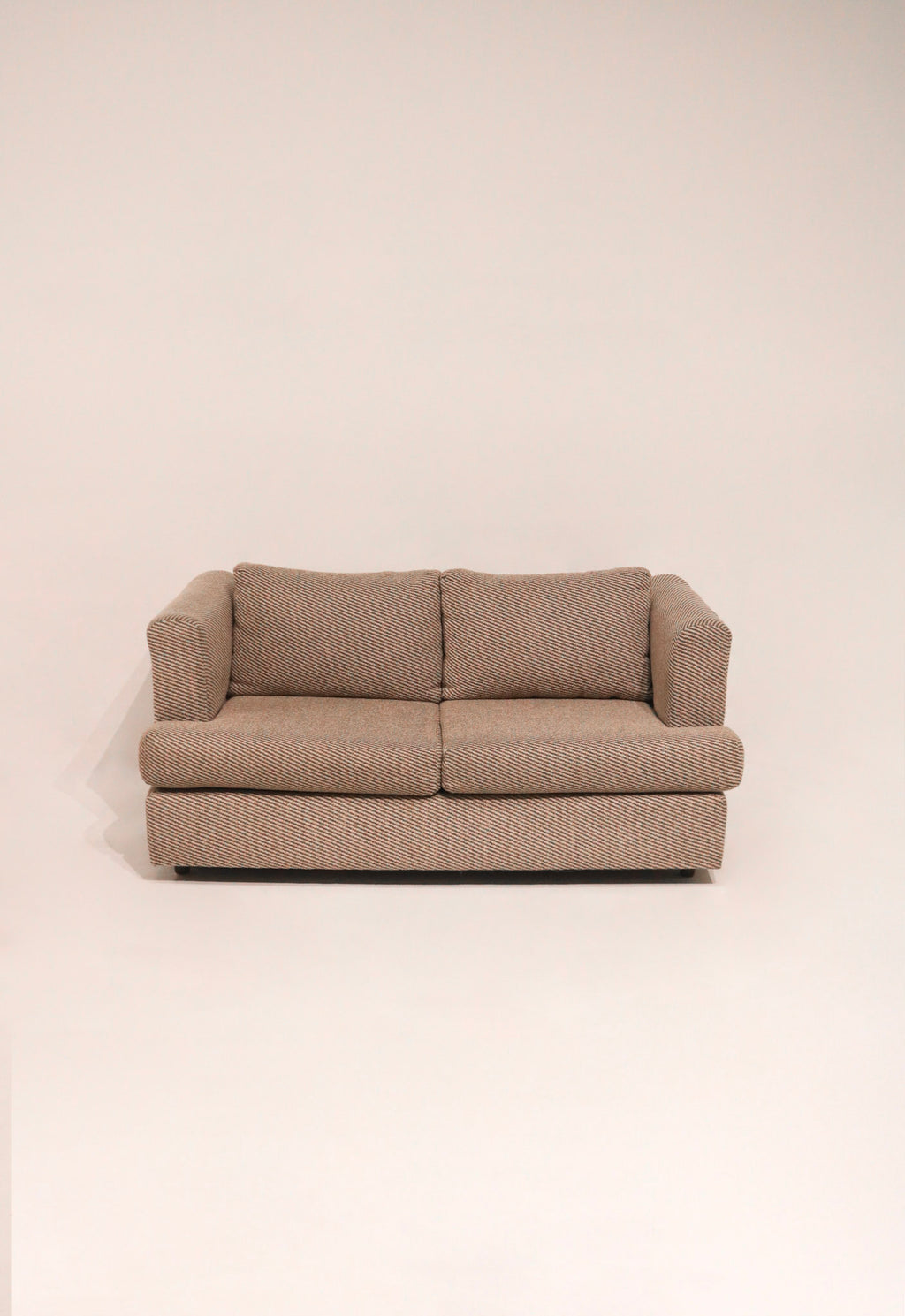 Front view of the two-cushion sofa design showing symmetry and comfort