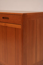 Full frontal view of the minimalist teak credenza showing symmetry