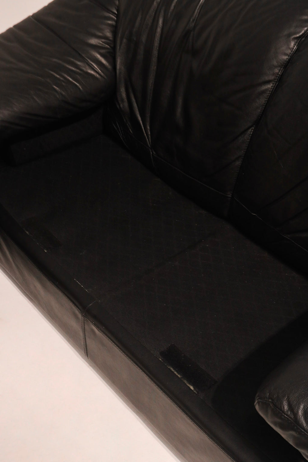 Full side angle view showing armrest support and overall sofa proportions