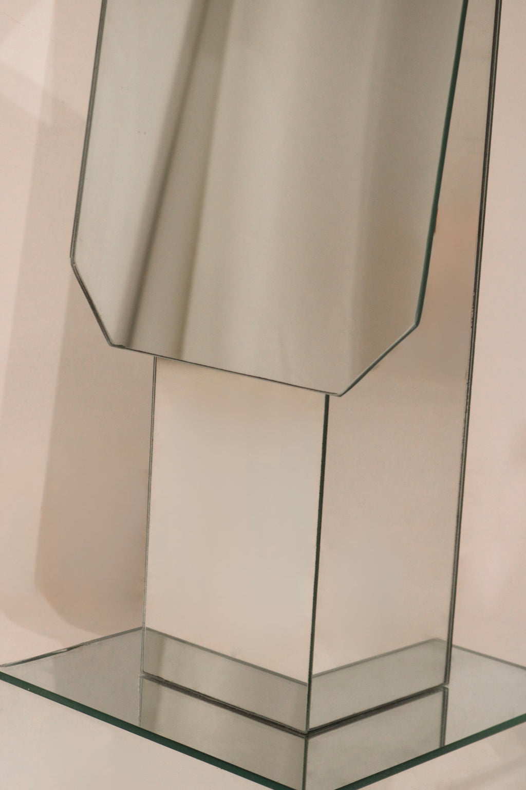 Close-up geometric mirrored panels detail showing reflective surface quality