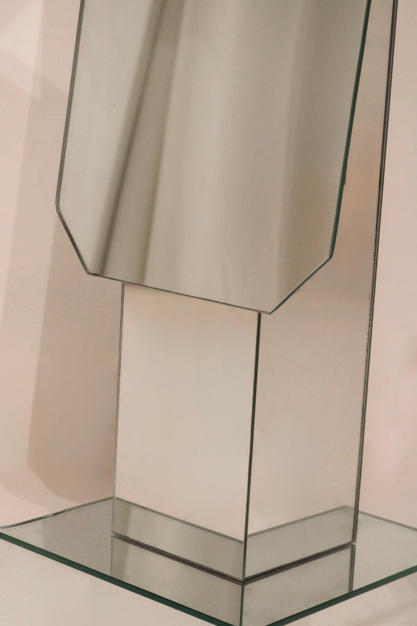 Close-up geometric mirrored panels detail showing reflective surface quality