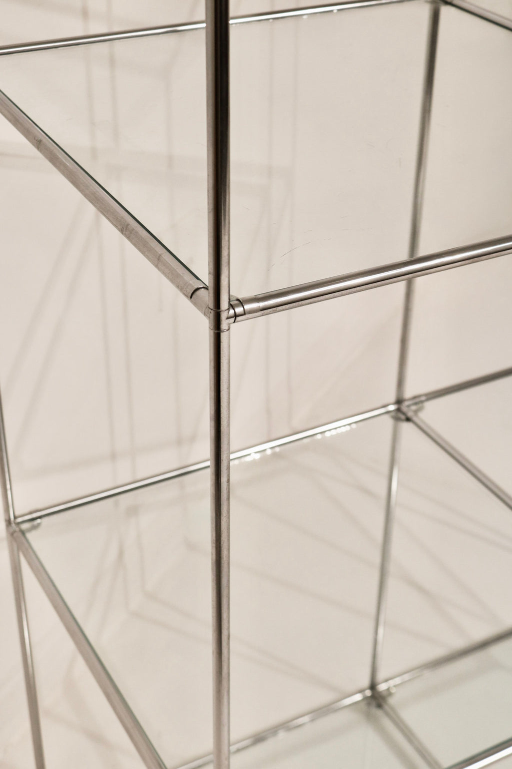 View showing glass shelf clarity and transparency within the steel frame