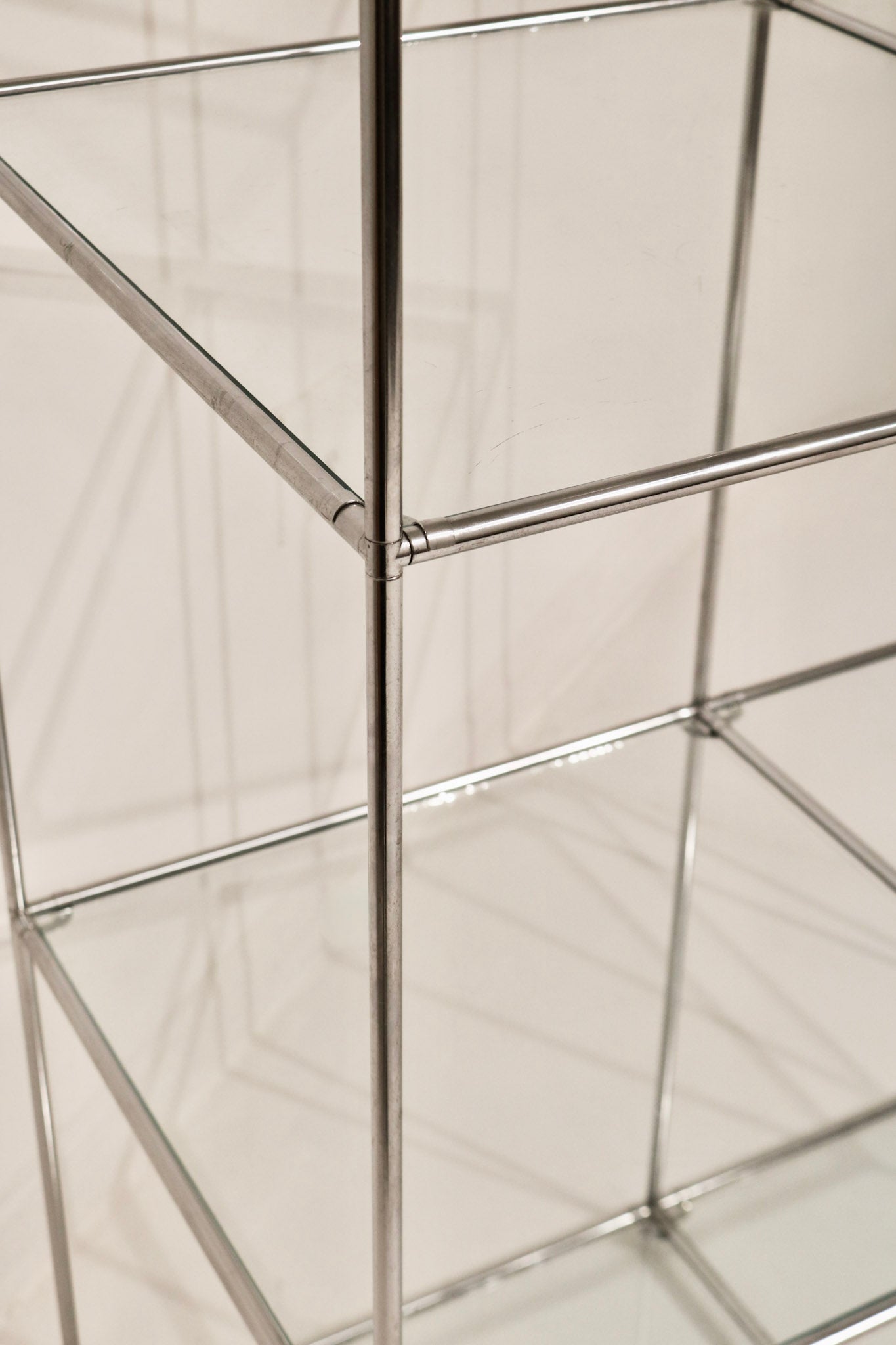 View showing glass shelf clarity and transparency within the steel frame