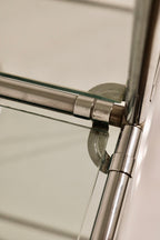 Close-up of glass shelf support clip and corner construction