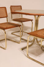 Detail of glass table top corner inserted in wood frame