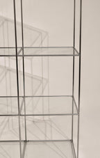View of the grid structure and glass shelves arrangement looking through