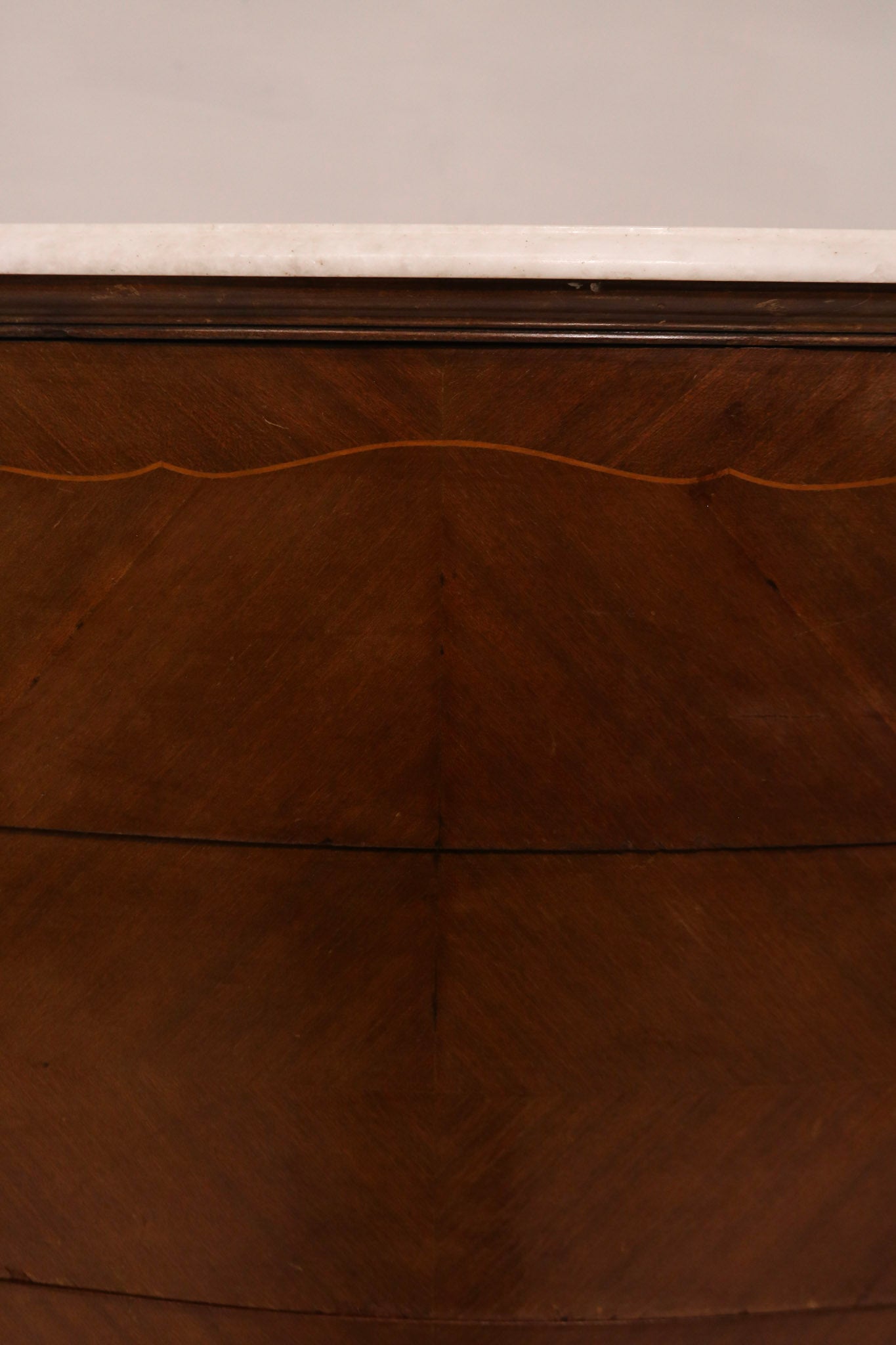 Detail of inlay marquetry work on the drawer front panel