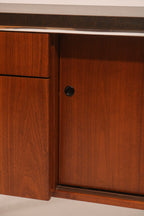 Close-up of integrated wood handle design on drawers