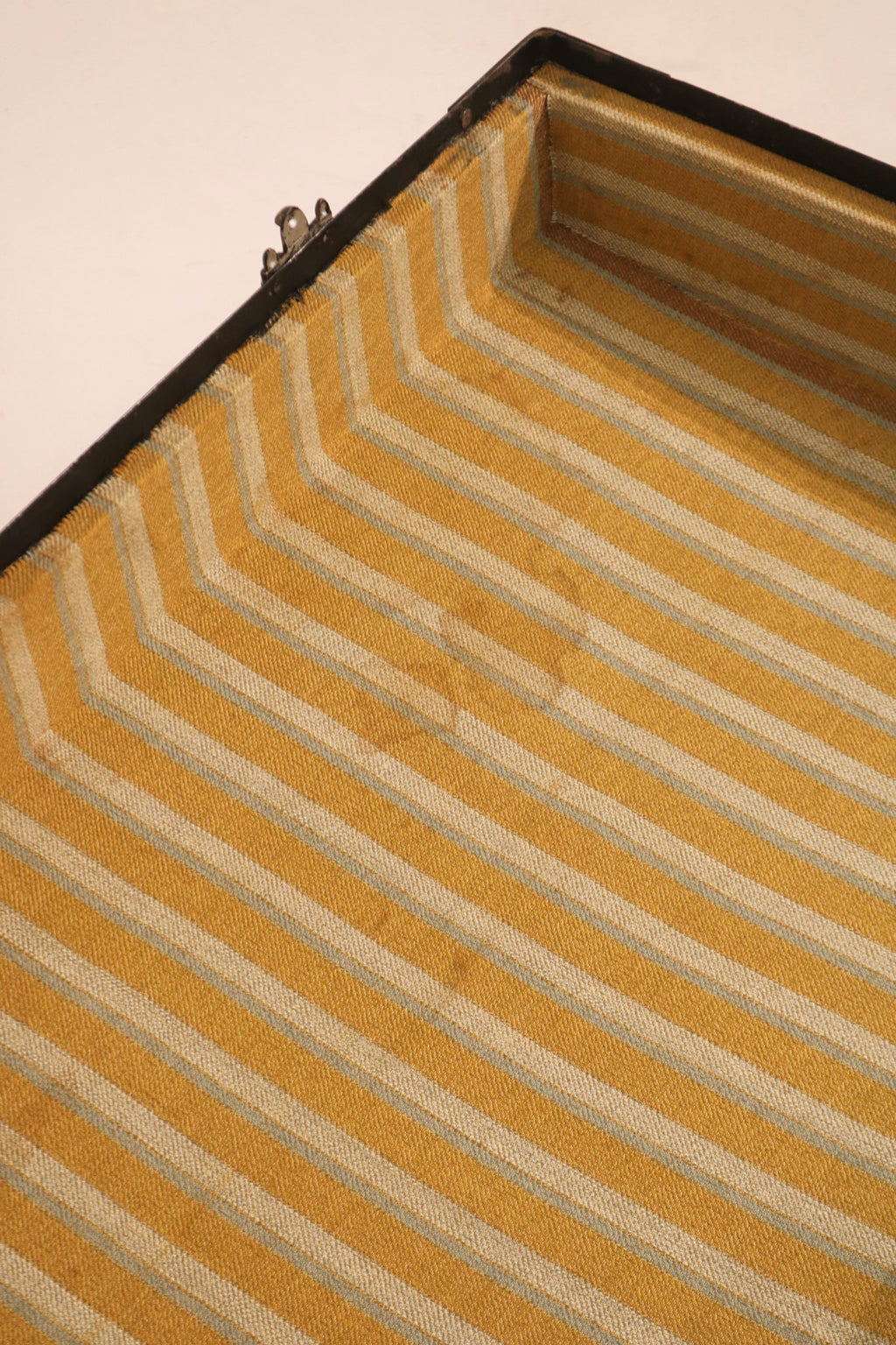 Detail of interior fabric lining condition showing yellow and white stripes